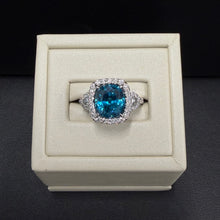 Load image into Gallery viewer, 18k White Gold Blue Zircon and Diamond Halo Ring
