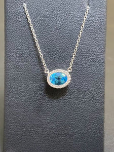 Dilamani 14k White Gold Blue Topaz and Diamond Oval Necklace on a 16-18" Cable Chain