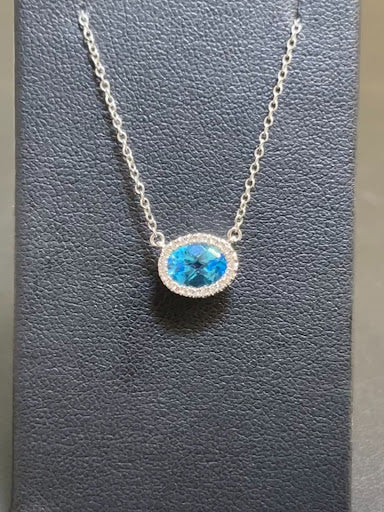 Dilamani 14k White Gold Blue Topaz and Diamond Oval Necklace on a 16-18