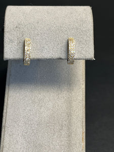 Ladies Dilamani 14k White Gold Diamond Pave Three Row Huggy Earrings.