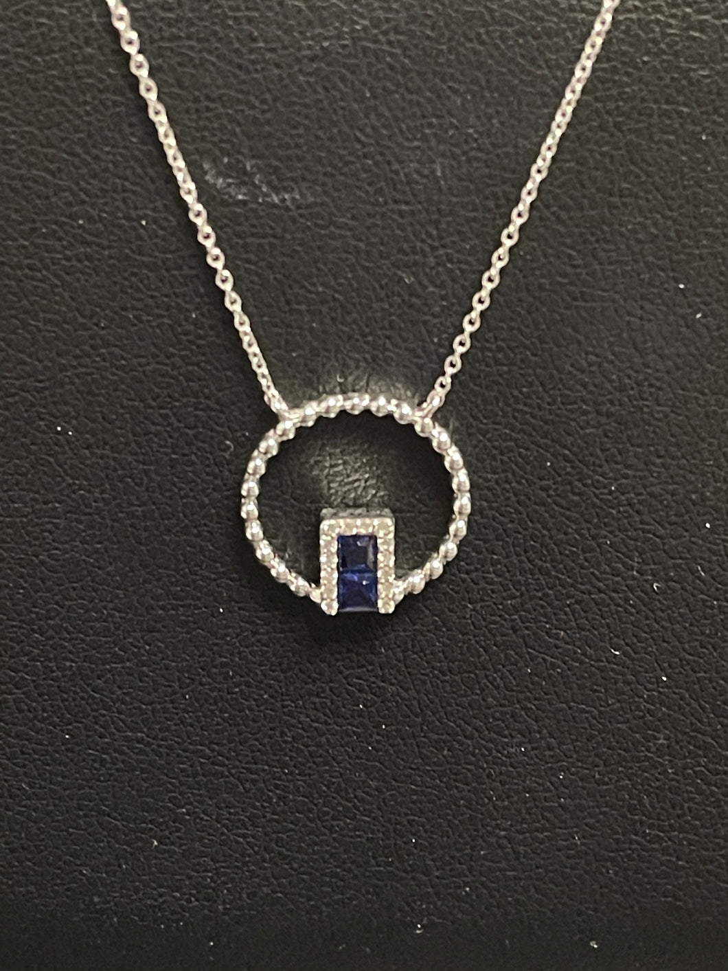 One Ladies 14k White Gold Sapphire and Diamond Pendant with Beaded Circle on an adjustable 16