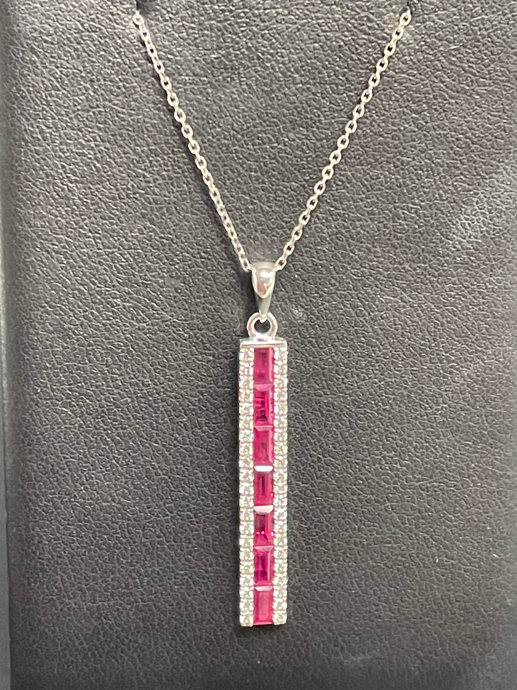 One Ladies 14k White Gold Diamond and Ruby Necklace